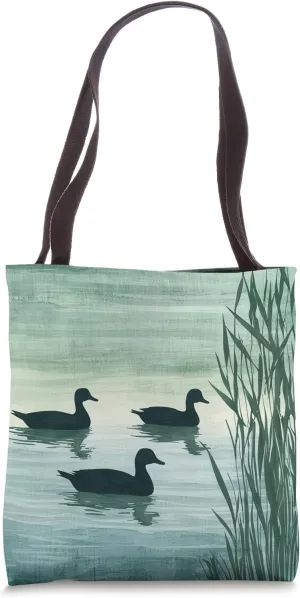 Silhouette Ducks on a Serene Pond, Nature's Tranquil Beauty Tote Bag